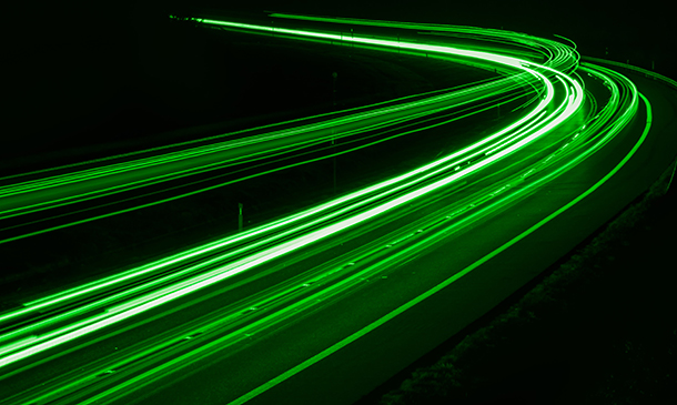 green car lights at night. long exposure